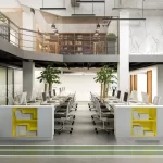 Modern open-plan office space in delhi with workstations, indoor plants, and a loft area with bookshelves